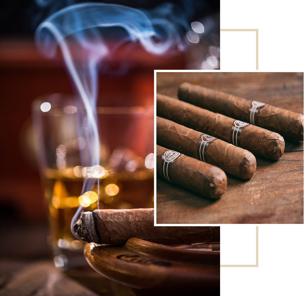 Cigars with smoke and whiskey glass.